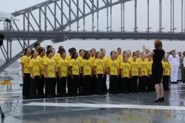 choir in front of harbour bridge